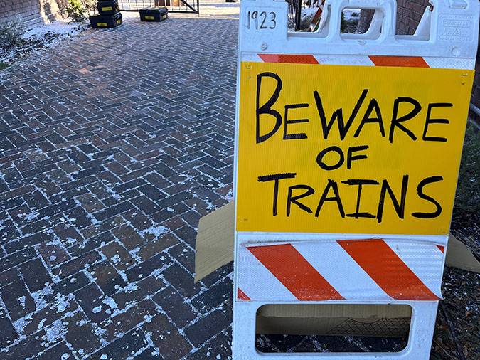 A sign outside the depot alerting the cast and crew to moving trains A sign outside the depot alerting the cast and crew to moving trains