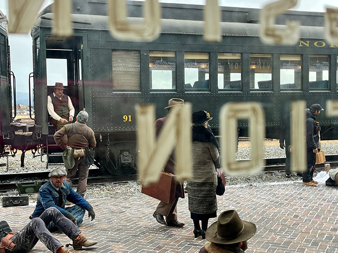 Brandon Sklenar, who plays Spencer Dutton, stands on the train in between takes Brandon Sklenar, who plays Spencer Dutton, stands on the train in between takes