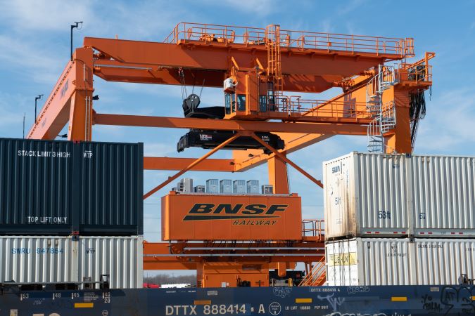 A BNSF intermodal crane operates at Alliance Intermodal Facility. A BNSF intermodal crane operates at Alliance Intermodal Facility.