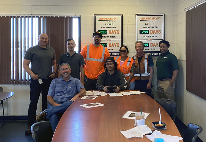 Team members at our Hobart hub celebrate a recent safety success milestone. Standing left to right: Terminal Superintendent Nelson Vargas, Trainmaster Sergio Flores, Conductor Justin Wallace, Engineer Michelle Alcala, Conductor Steve Tate and Assistant Superintendent Elijah Parker. Seated left to right: Terminal Manager Charles West and Conductor Eliseo Ortiz Team members at our Hobart hub celebrate a recent safety success milestone. Standing left to right: Terminal Superintendent Nelson Vargas, Trainmaster Sergio Flores, Conductor Justin Wallace, Engineer Michelle Alcala, Conductor Steve Tate and Assistant Superintendent Elijah Parker. Seated left to right: Terminal Manager Charles West and Conductor Eliseo Ortiz