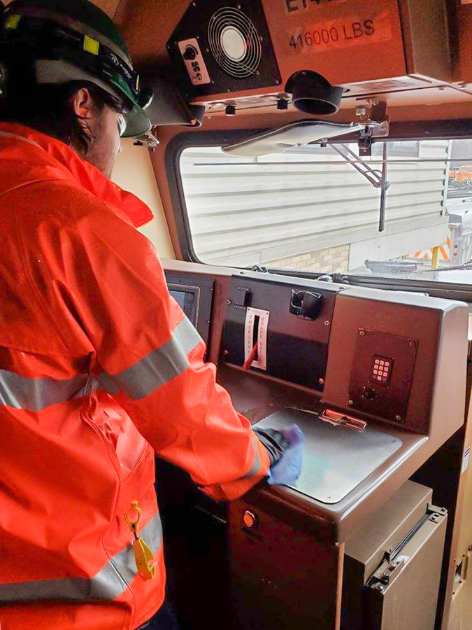 At our Northtown Shop, employees are wiping down and sanitizing locomotive cab interiors.