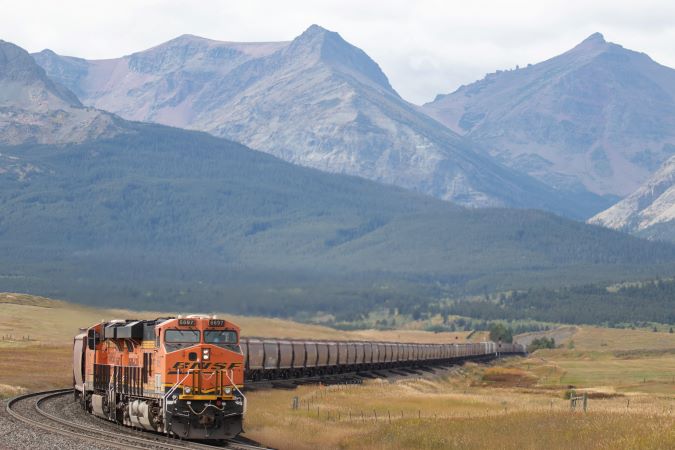 BNSF train and mountains in the back. BNSF train and mountains in the back.