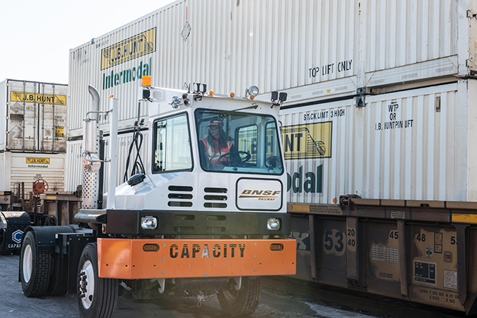A BNSF hostler next to J.B. Hunt containers A BNSF hostler next to J.B. Hunt containers