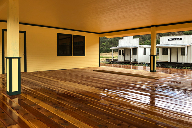 This covered porch will serve as a crew meeting point as well as the rainy-day location of the railroad jubilee campfire. This covered porch will serve as a crew meeting point as well as the rainy-day location of the railroad jubilee campfire.