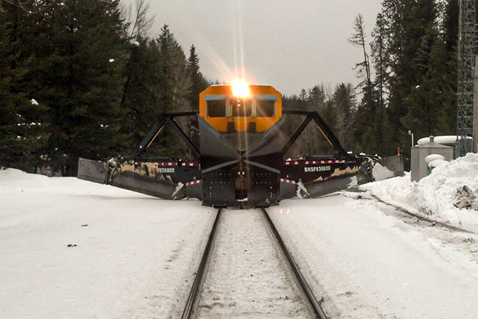 An operating Jordan Spreader pushing aside snow. An operating Jordan Spreader pushing aside snow.