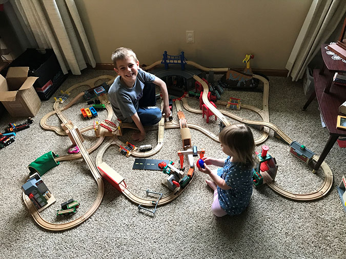 Jacob, his sister, Hailey, and his extensive toy train set Jacob, his sister, Hailey, and his extensive toy train set
